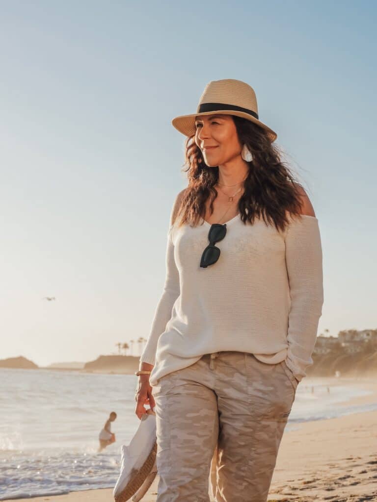 woman in hat on beach